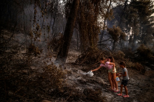 Greece fire battle rages on as locals count cost of devastation