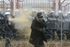 Poles fire tear gas, water cannon at migrants on Belarus border.jpg