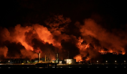 Third fuel tank collapses as helicopters battle Cuban blaze.jpg