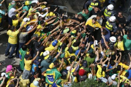 Brazil's Bolsonaro slams election ban as thousands rally behind him.jpg