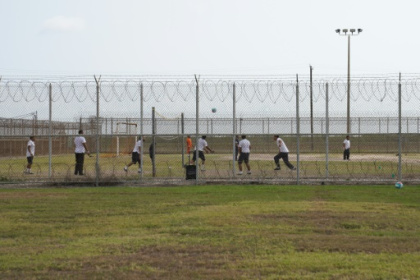 Color-coded migrants wait for answers in Texas heat.jpg
