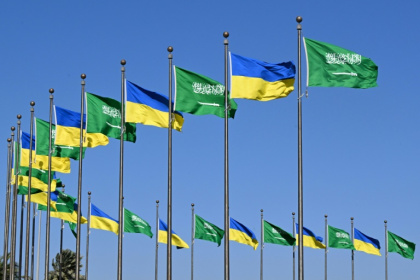 Flags of Saudi Arabia and Ukraine line a road in Jeddah before a visit by Ukainian President Volodymyr Zelensky