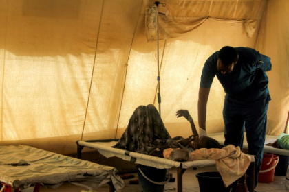A doctor visiting a cholera patient at an isolation unit outside the Bashayer Hospital, south of Khartoum. Nearly 100,000 cases have been reported since July 2024 - - (AFP)