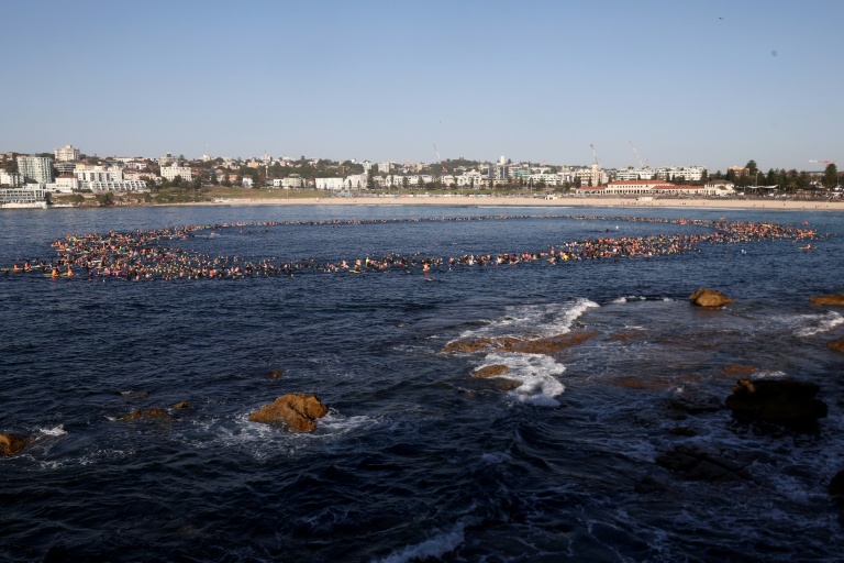 Australia announces gun buyback as swimmers mourn Bondi shooting victims
