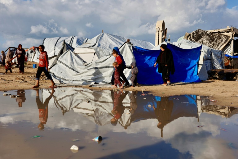 'Shivering from cold and fear': winter rains batter displaced Gazans