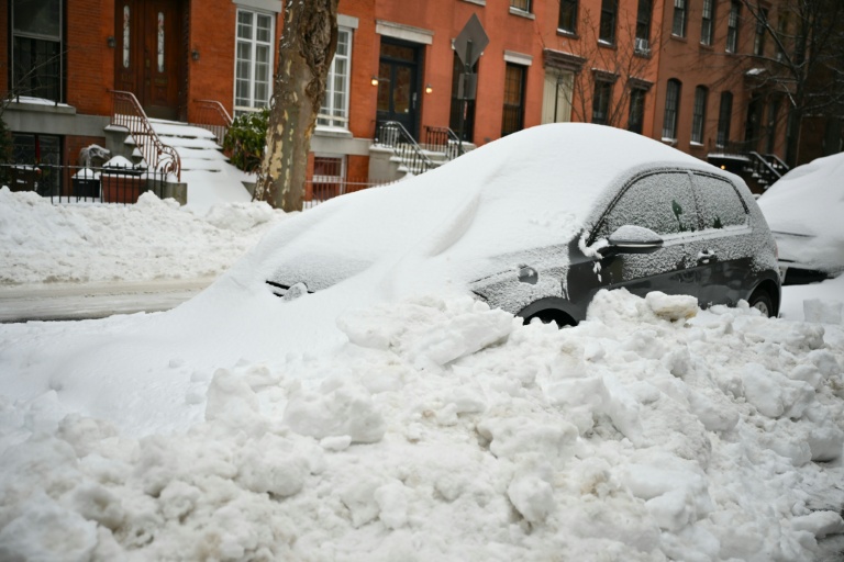 Extreme cold grips millions as US digs out of deadly snowstorm