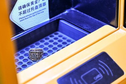 China is the world's largest consumer of gold, but now many are looking to sell - Hector RETAMAL (AFP)
