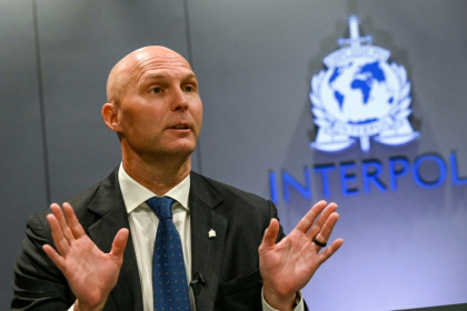 From perfectly spelled phishing emails to fake videos of government officials, AI is changing the game for Interpol's fight against cybercrime - Roslan RAHMAN (AFP)