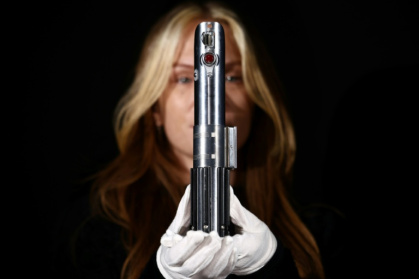 This 'Star Wars' lightsaber has been used by characters Luke Skywalker and Rey - HENRY NICHOLLS (AFP)