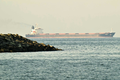 Vessels in the Middle East -- here, a cargo ship in the Strait of Hormuz -- are battling difficulties with their outdated GPS capabilities - Giuseppe CACACE (AFP)